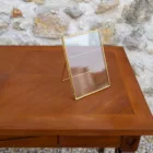 Cadre verre et or sur pied 1