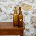 Grande bouteille en verre ambré vintage